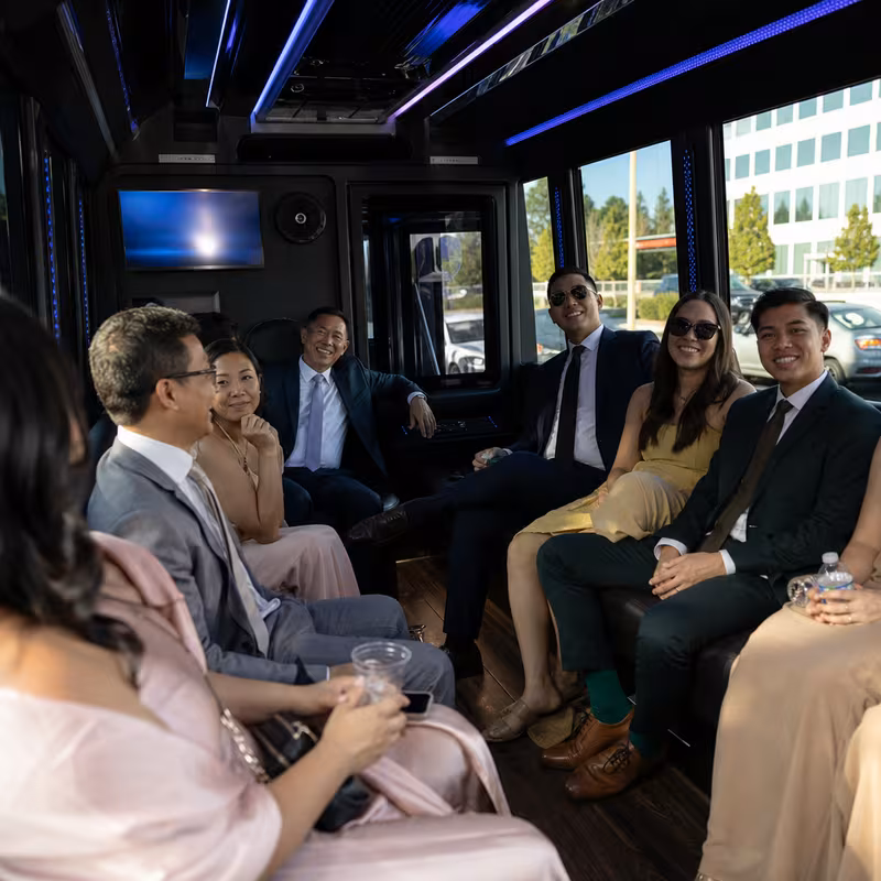 Wedding guests seated inside a Sunnyvale party bus