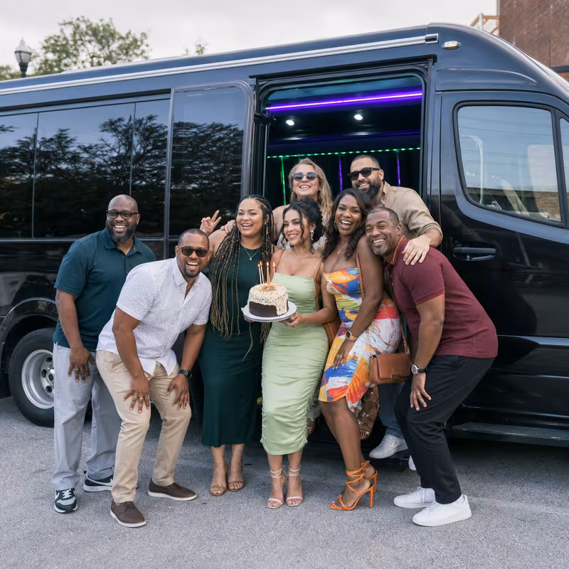 Group boarding a white charter bus for Birthday Transportation transportation in Sunnyvale