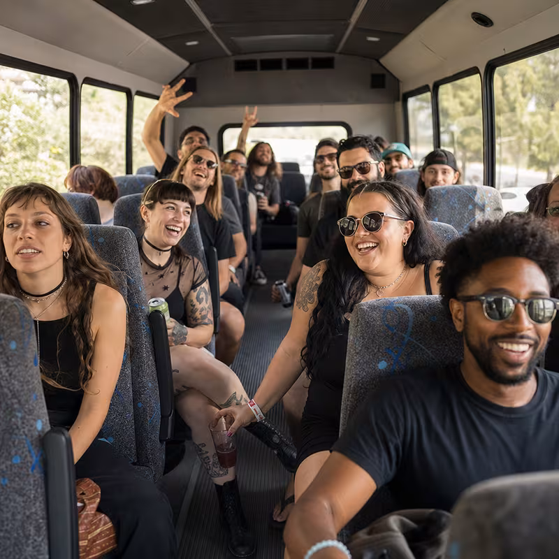 Party bus interior with wraparound leather seating and LED lighting in Sunnyvale