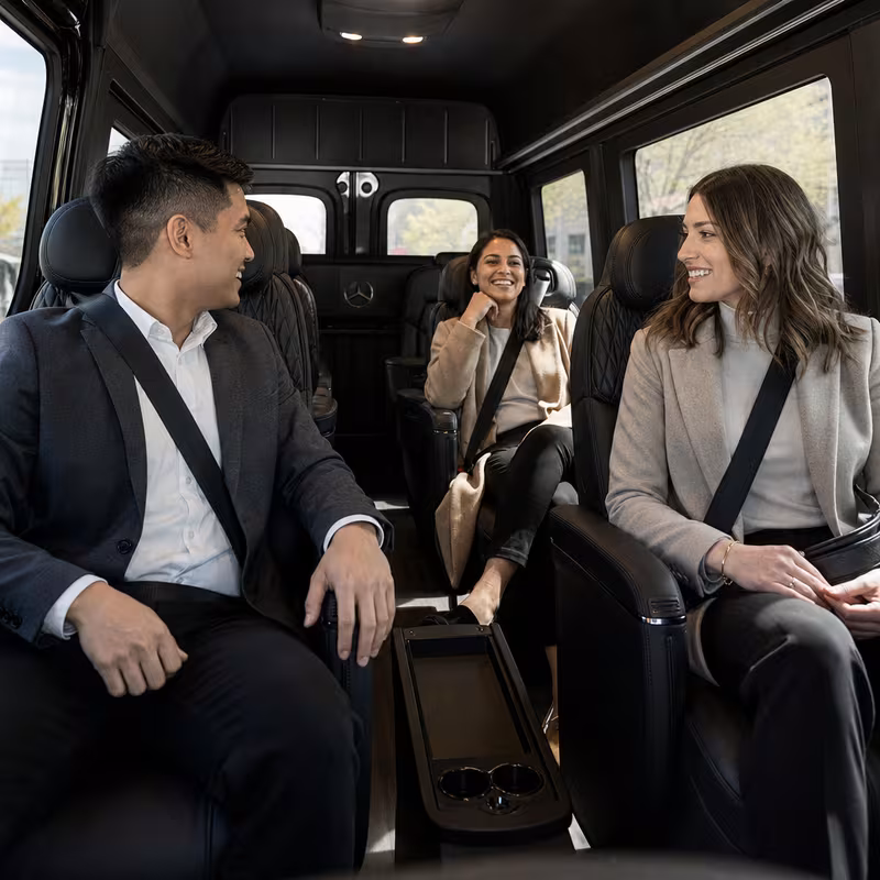 Group boarding a white charter bus for Corporate Transportation transportation in Sunnyvale