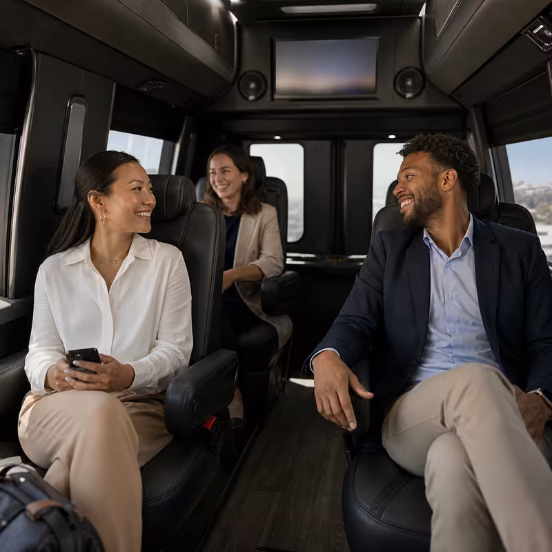 Passengers loading luggage while boarding an Sunnyvale group shuttle