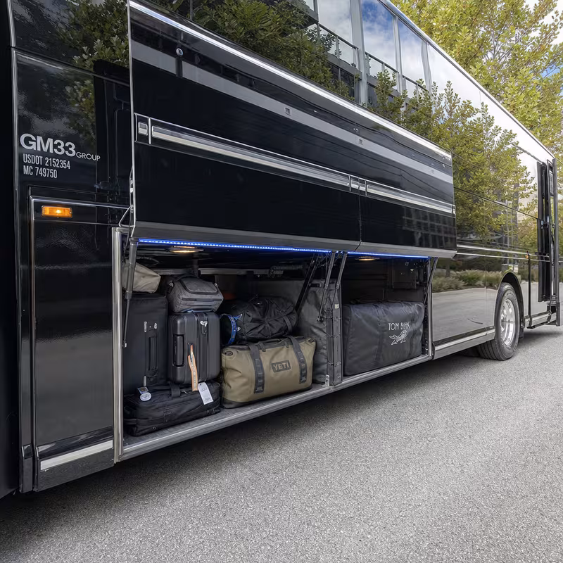 Party bus interior with wraparound leather seating and LED lighting in Sunnyvale