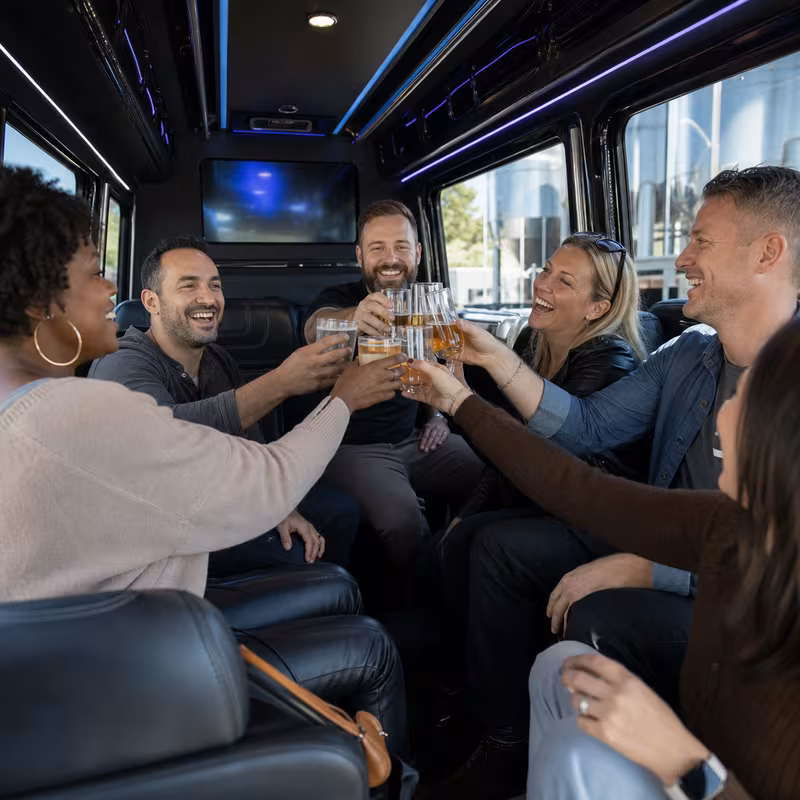 Group boarding a white charter bus for Winery & Brewery Tour Transportation transportation in Sunnyvale